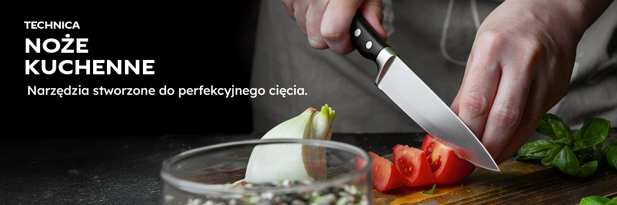 Profesjonalny nóż kuchenny Technica podczas krojenia pomidora i cebuli na desce roboczej